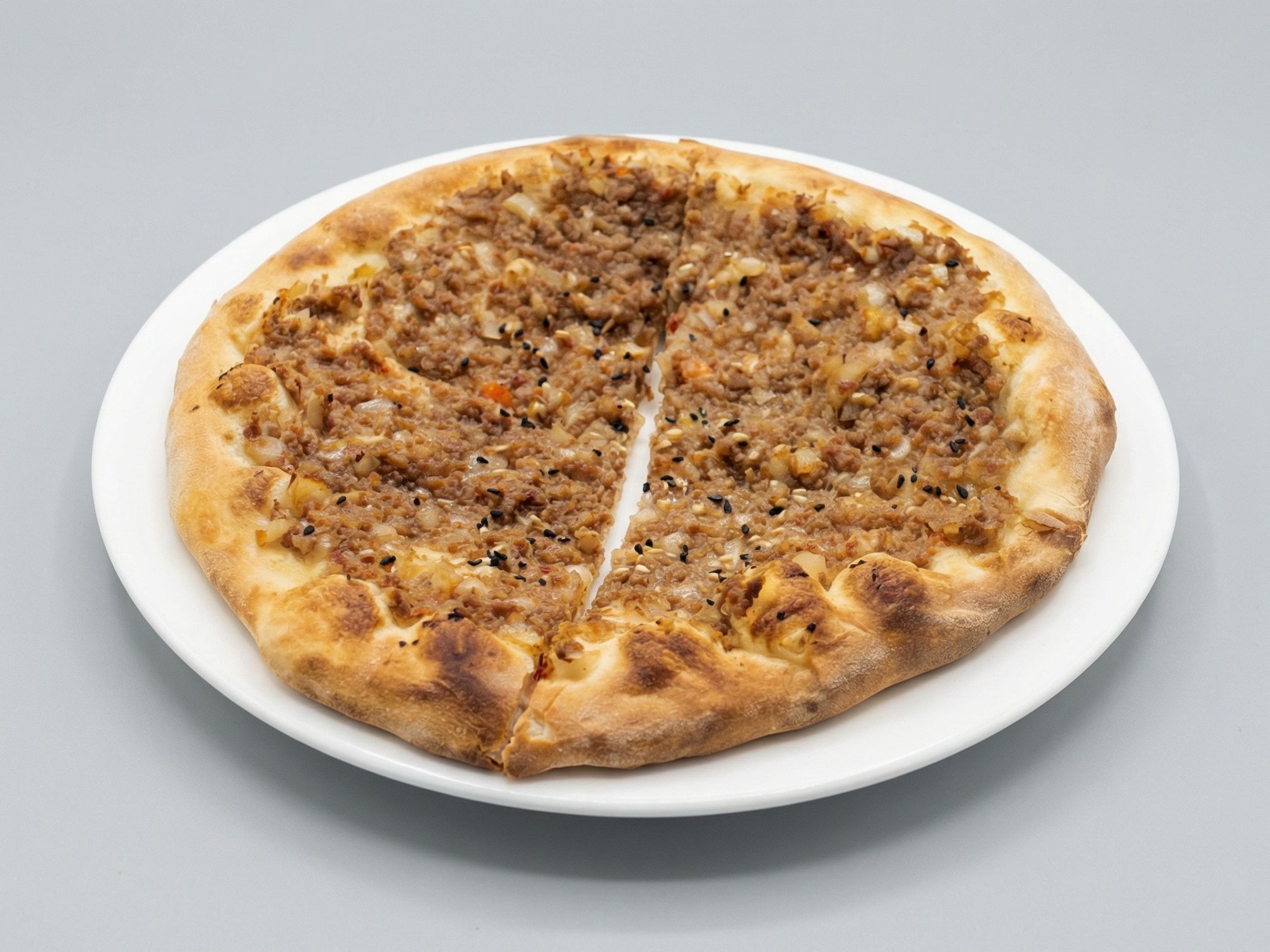 Meat Safiha with pomegranate molasses Manakish