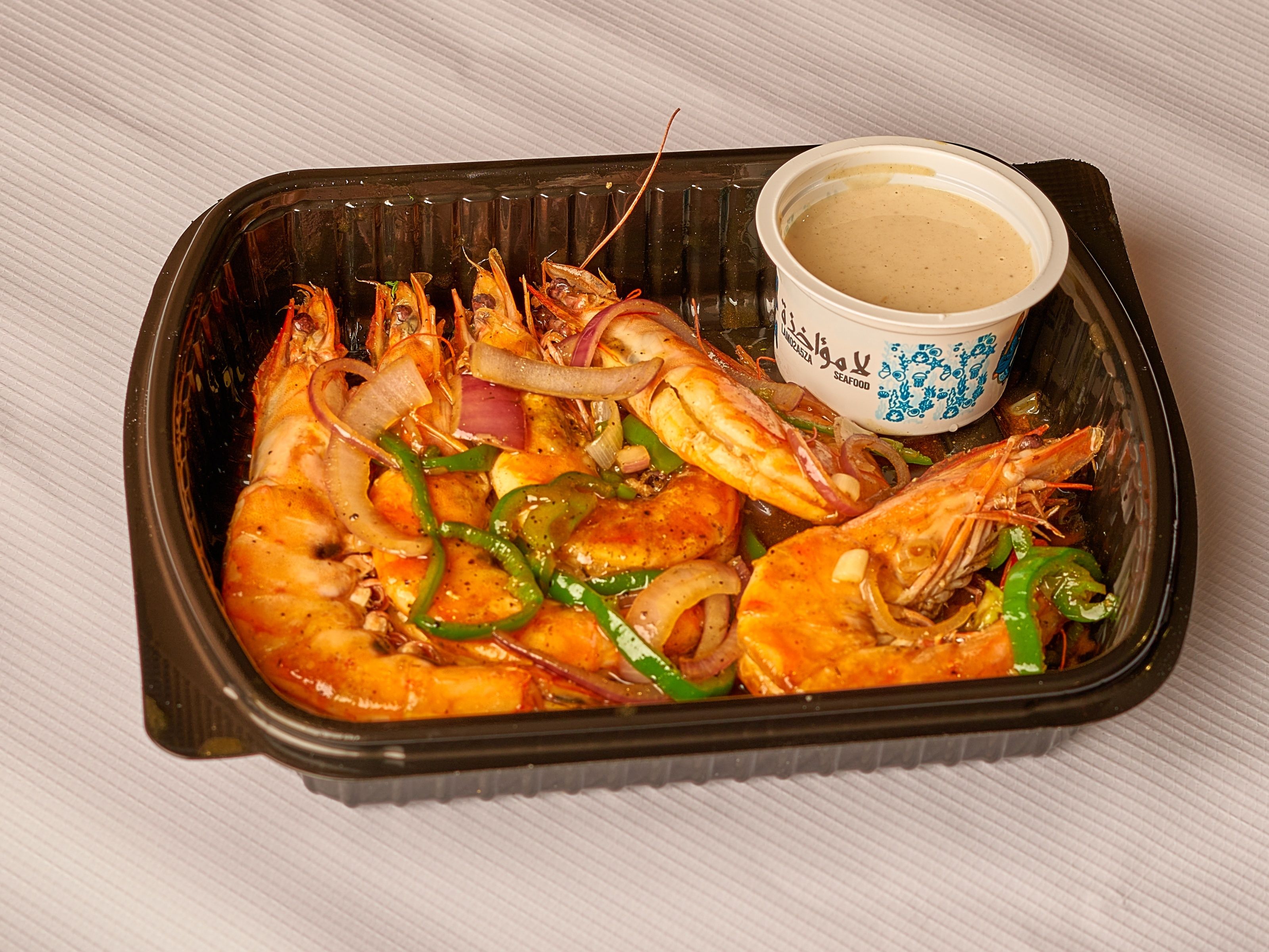 Quarter of grilled shrimp shells fajita
