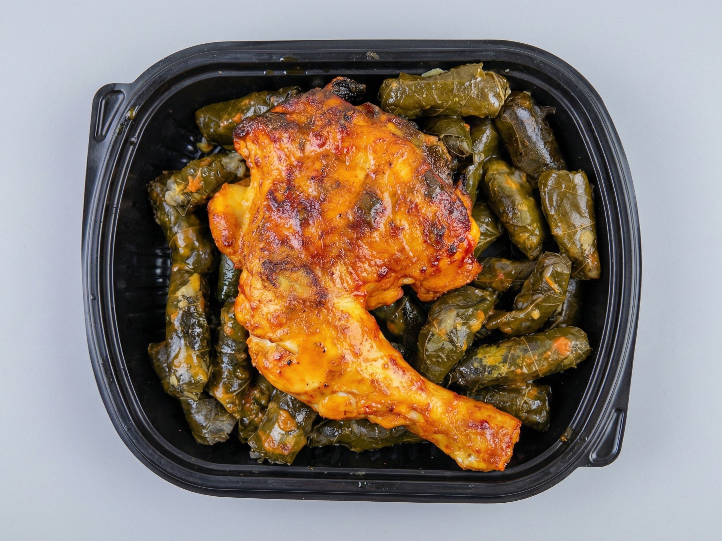 Grape leaves and chicken thigh meal