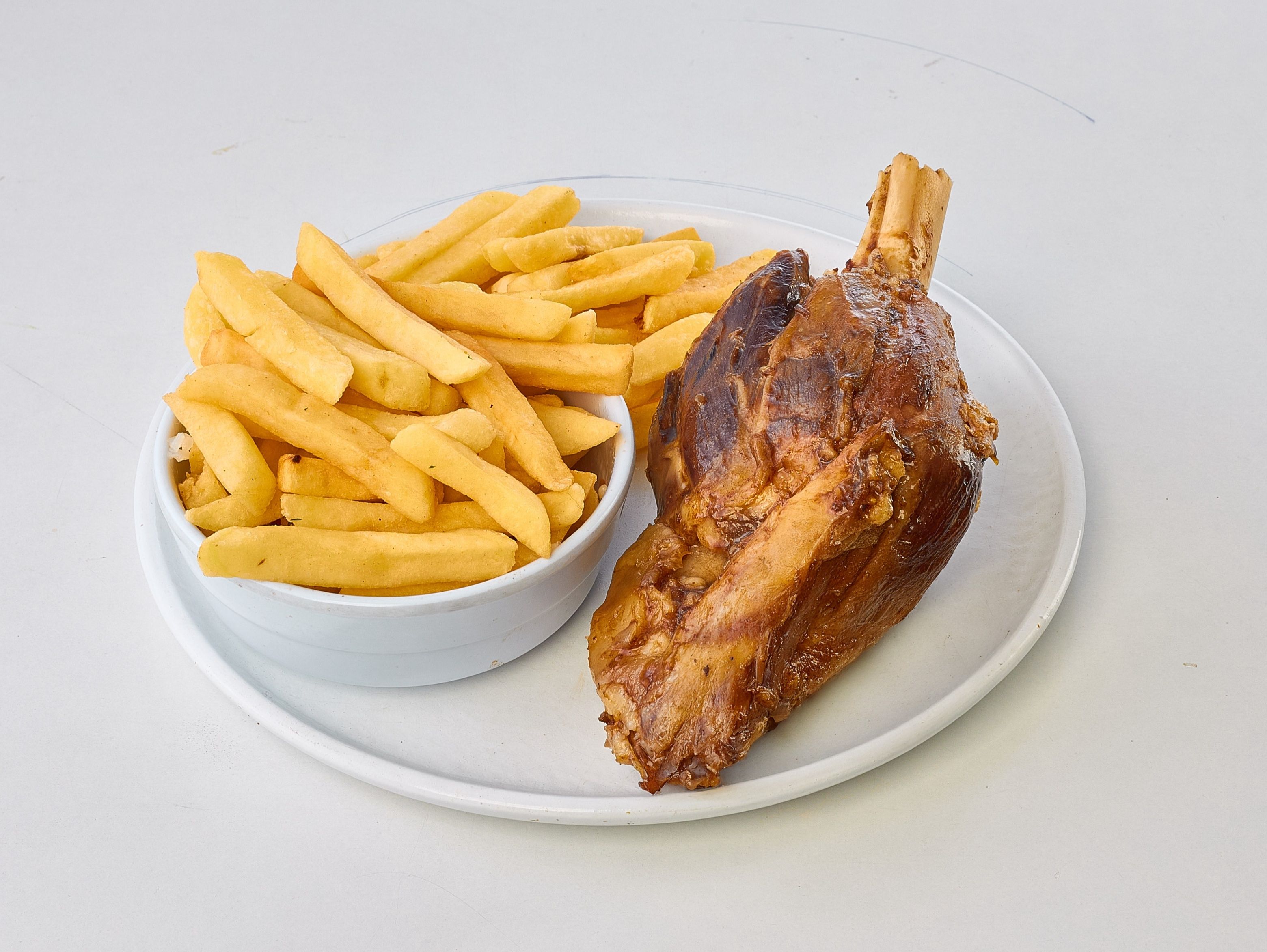 Charcoal-grilled lamb shank