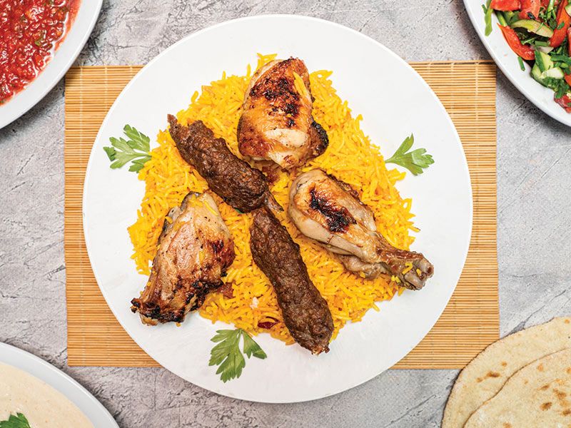 Mix 2 consists of a chicken thigh with 2 kofta, rice, and salad.