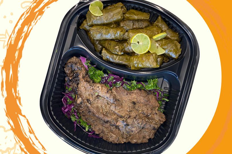 Beef steak meal with grape leaves