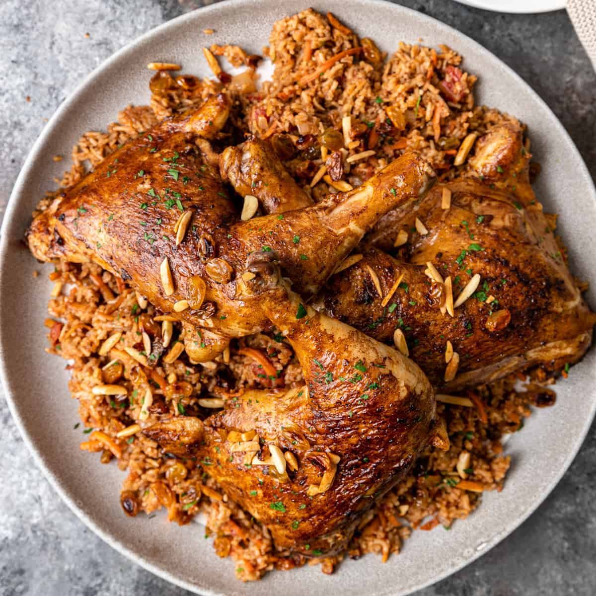 A quarter of chicken kabsa served with Spicy rice