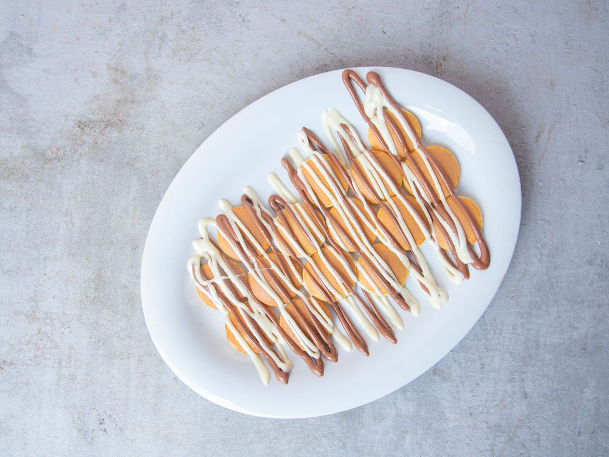 Pancakes with chocolate sauce and white chocolate