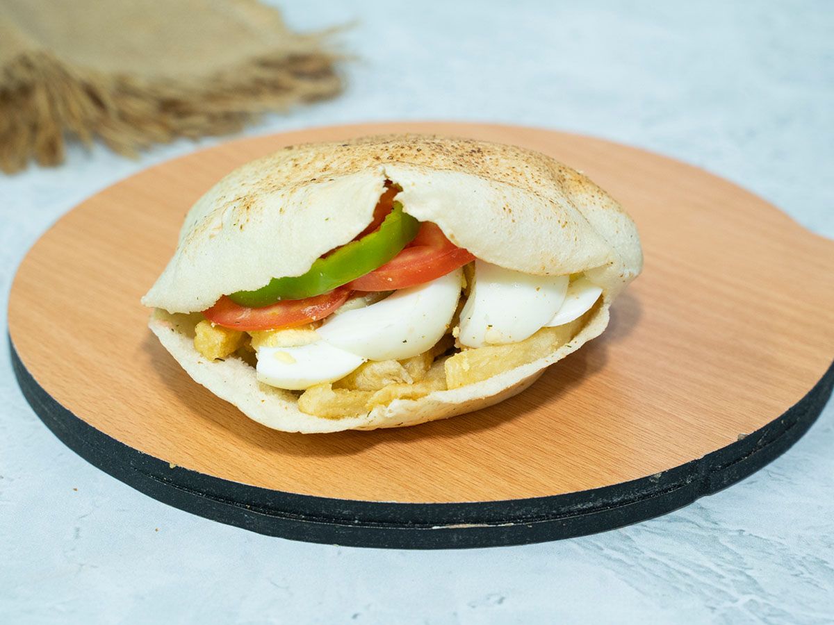 French fries sandwich with boiled egg