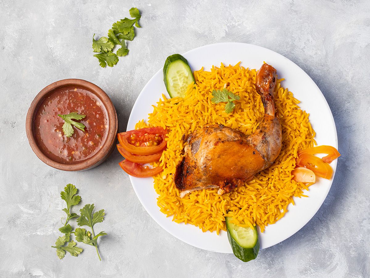 quarter mandi chicken, rice and sauce