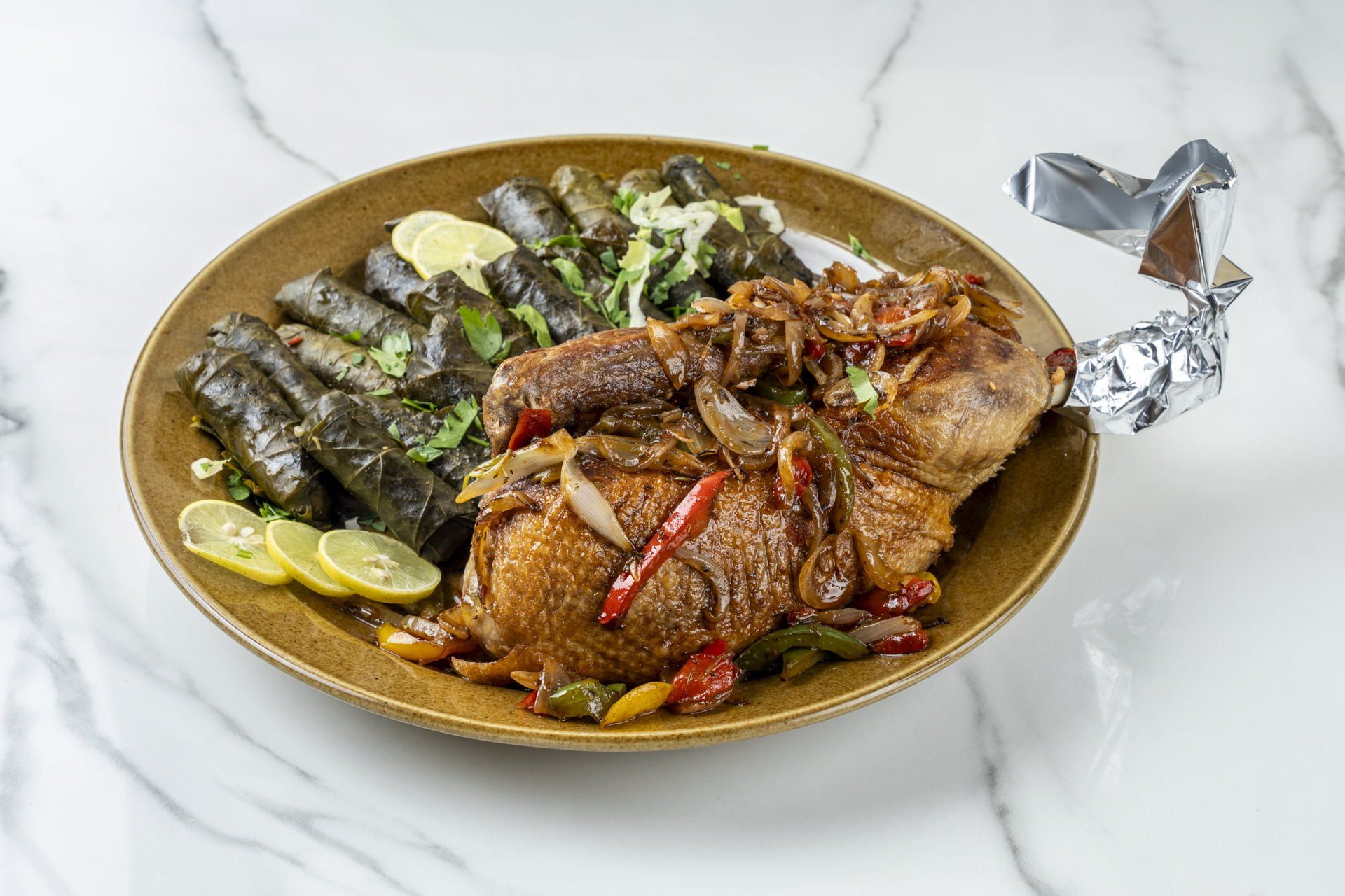 Half duck with grape leaves