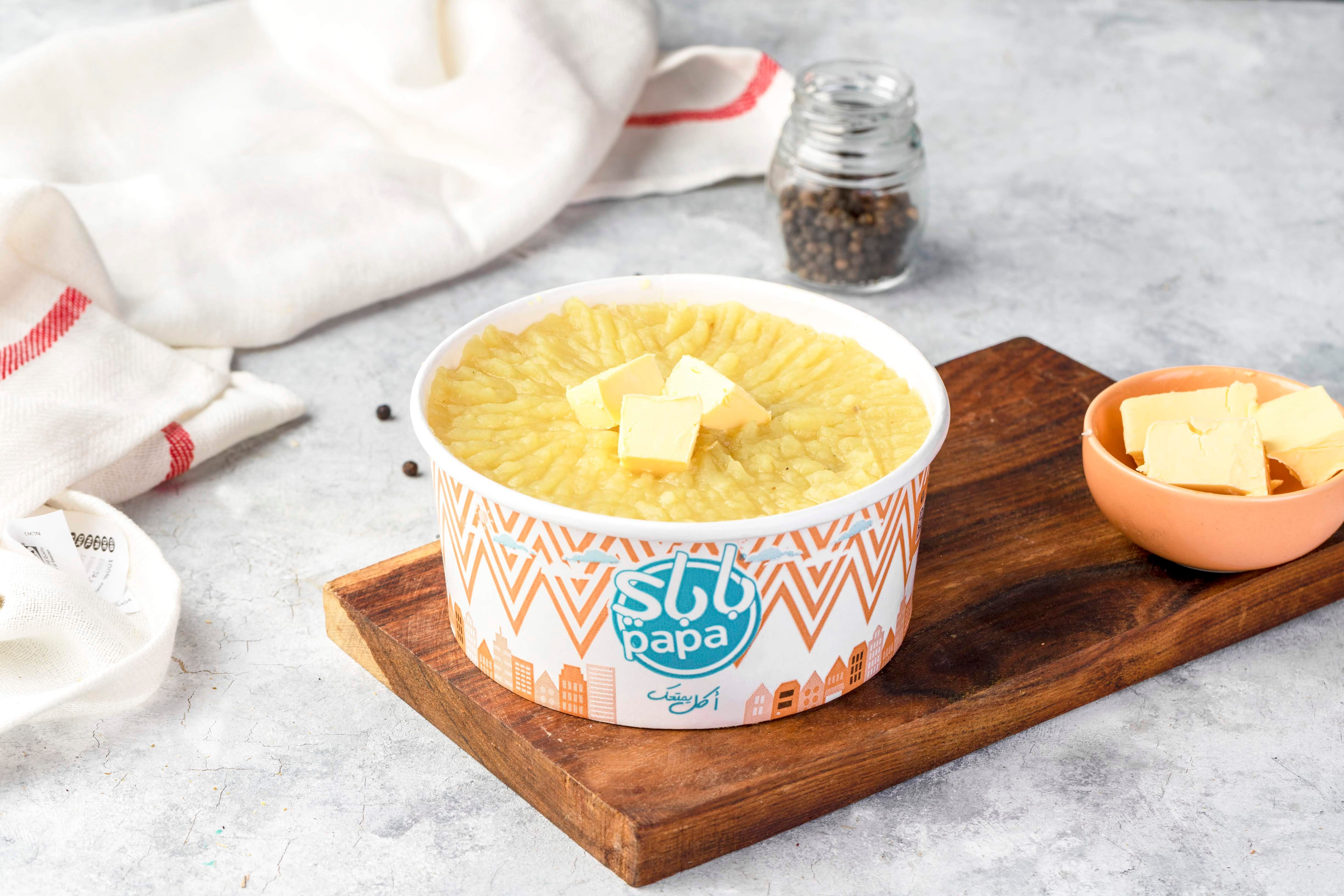 Box of mashed potatoes with butter