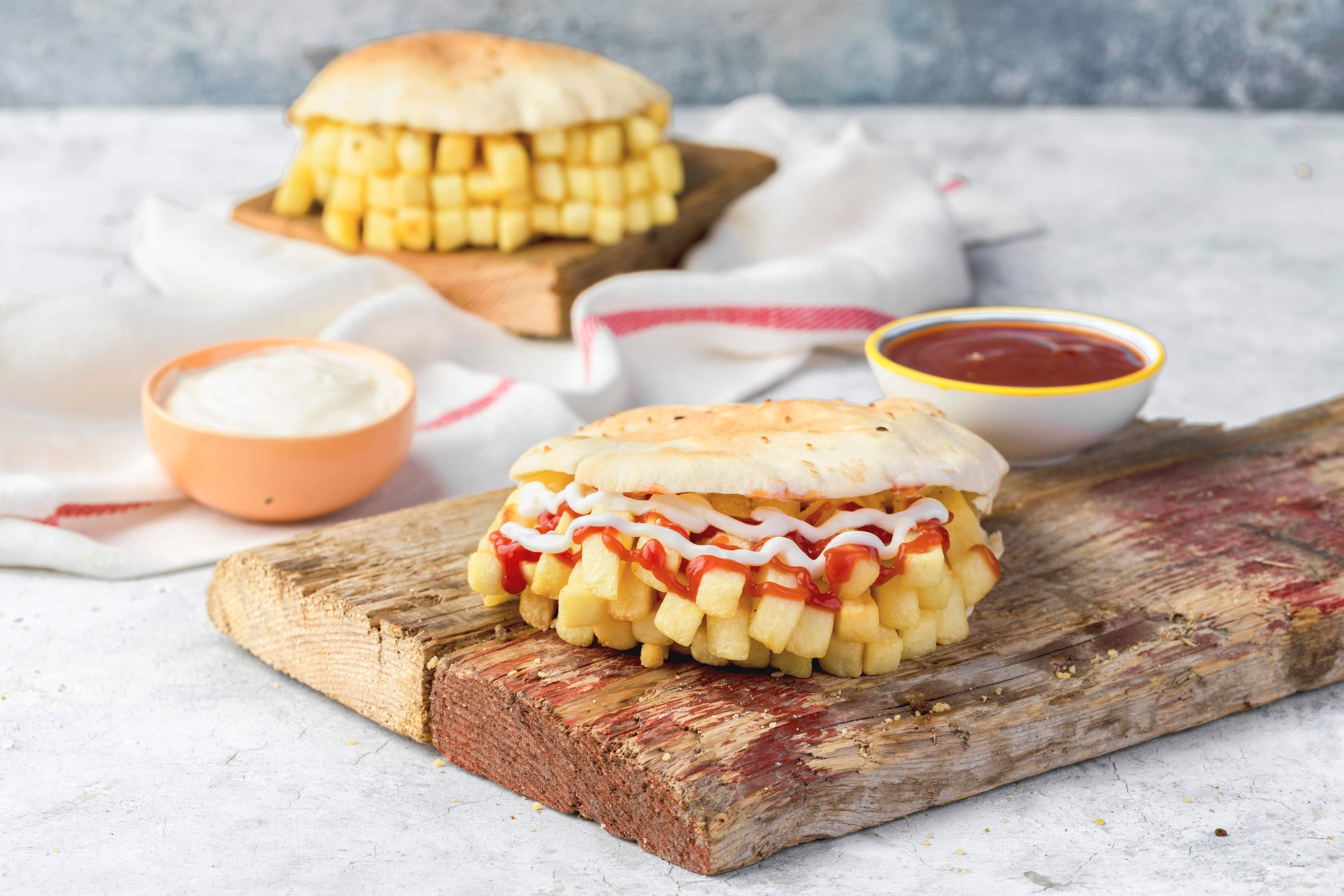 French fries roll sandwich with ketchup and mayonnaise