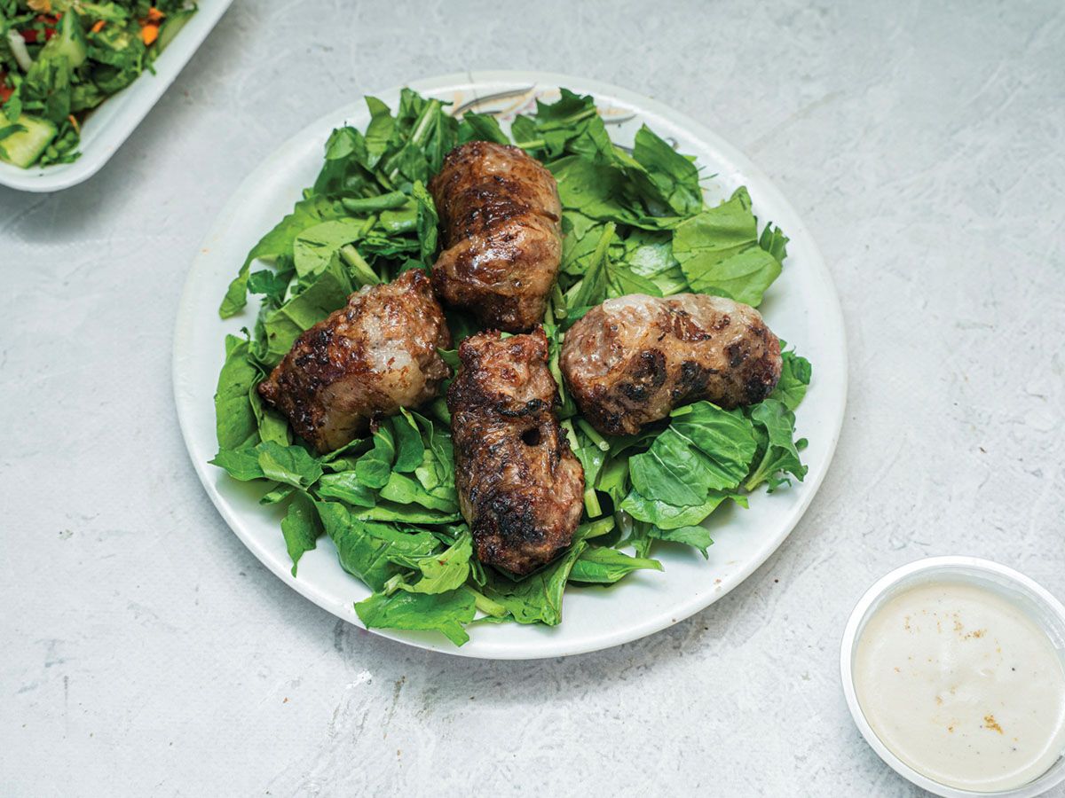 1/4 kg lamb tarab with green salad, bread, and tahini