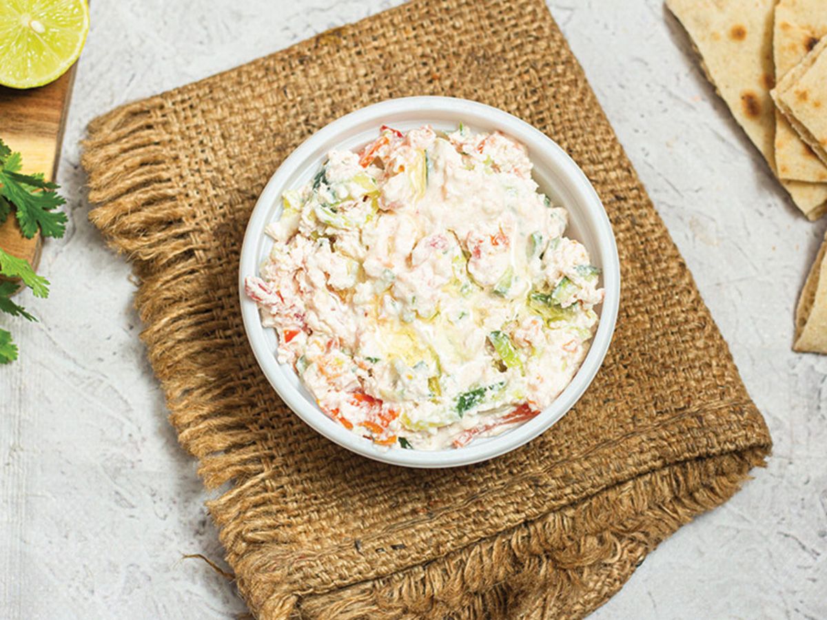 A Box Of Feta Cheese And Small Tomatoes