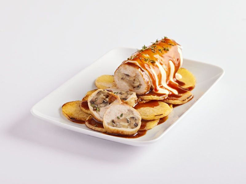 Roasted Chicken Roll On A Bed Of Potatoes