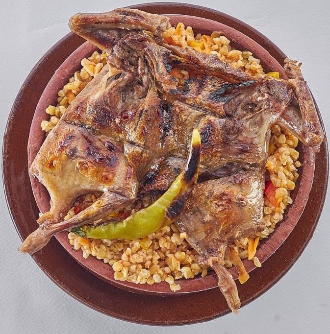 Freekeh tagine with grilled pigeons