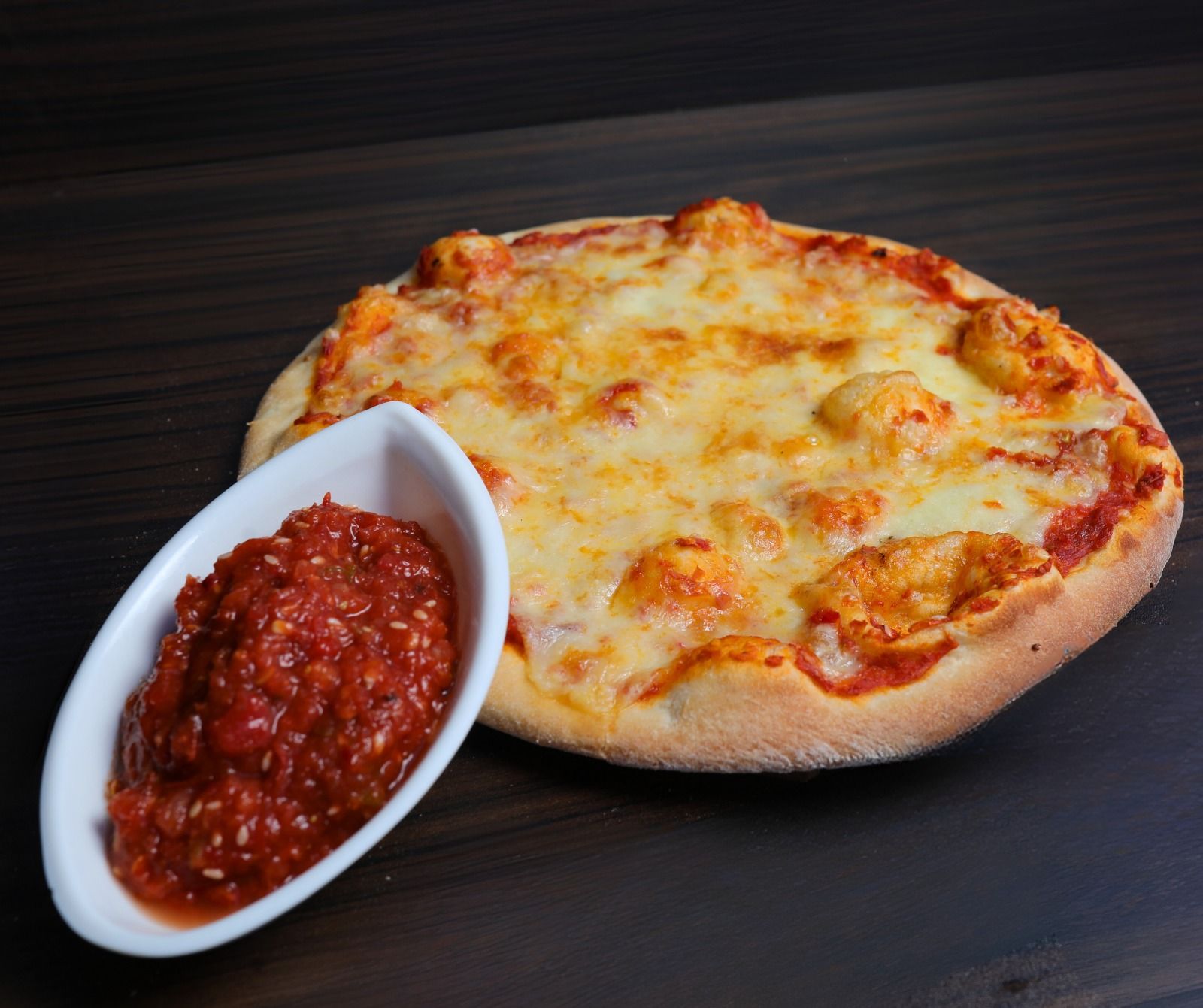 Manousheh with Mohammarah and Kashkaval cheese