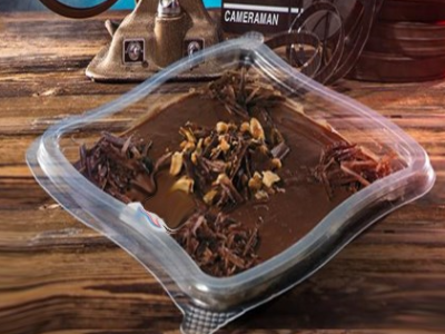 Pudding With Nuts And Chocolate Sauce