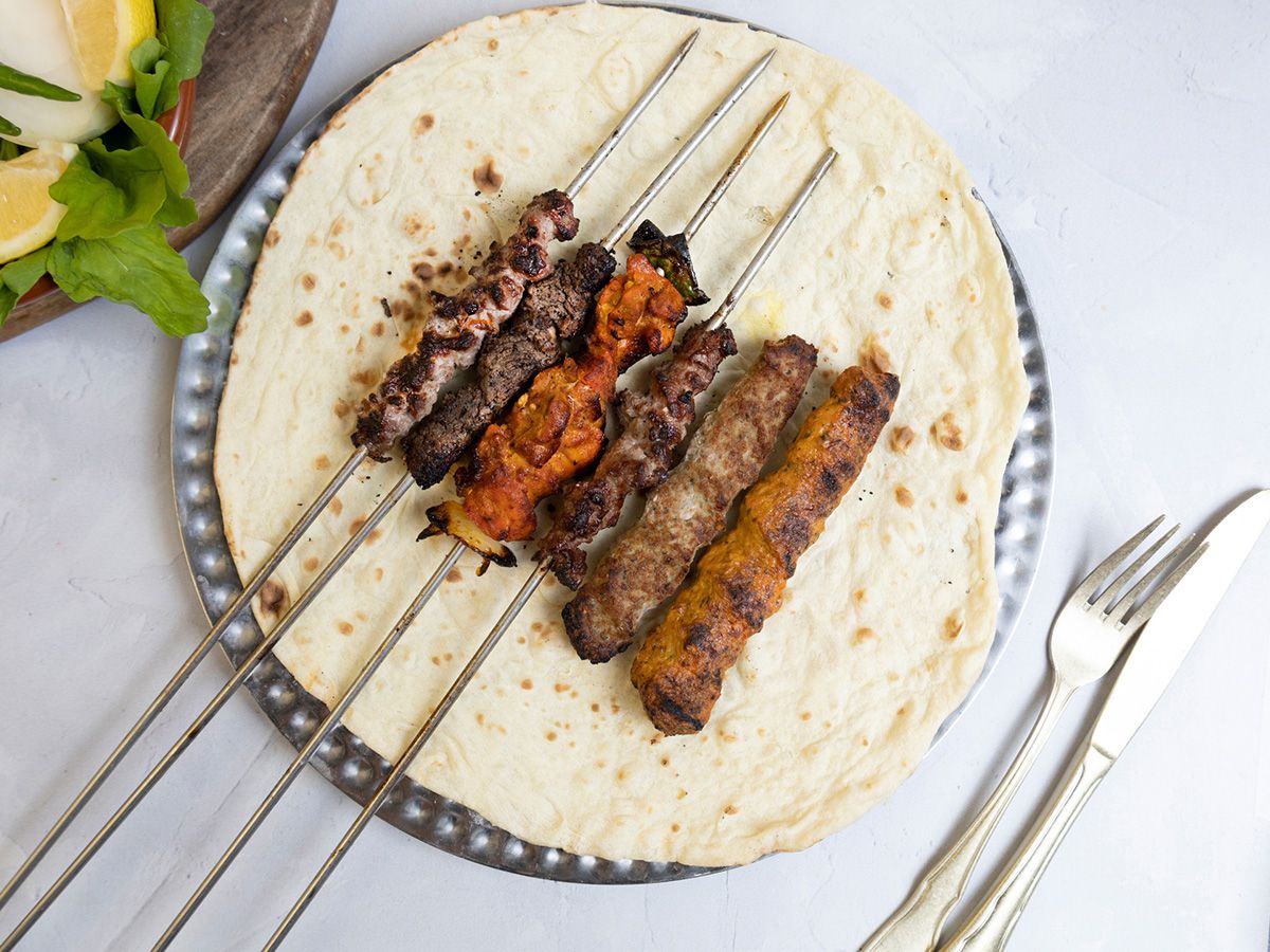 1/2 Mixed grill on charcoal with green salad, bread, and tahini
