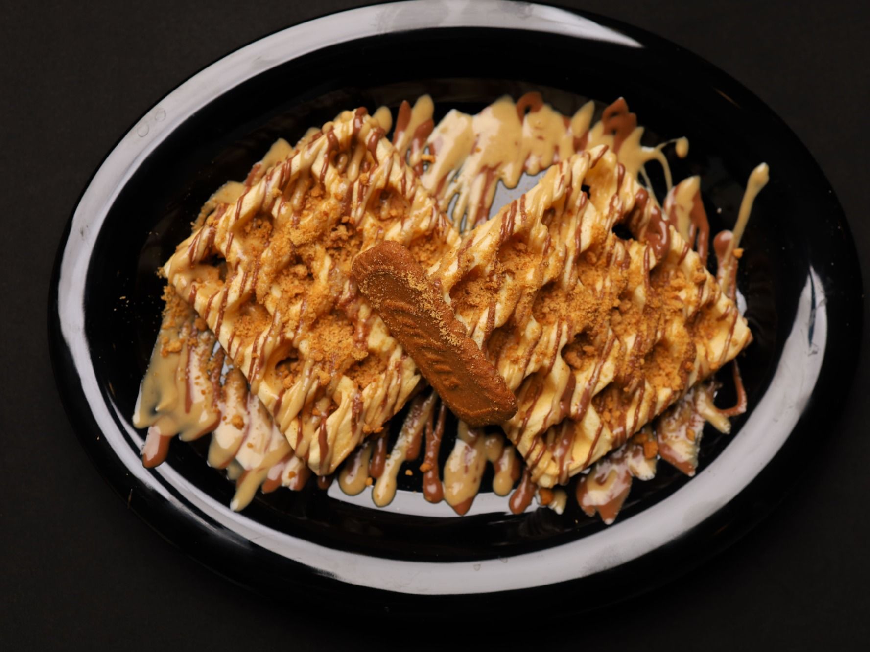 Waffle With Chocolate Sauce And Lotus Sauce