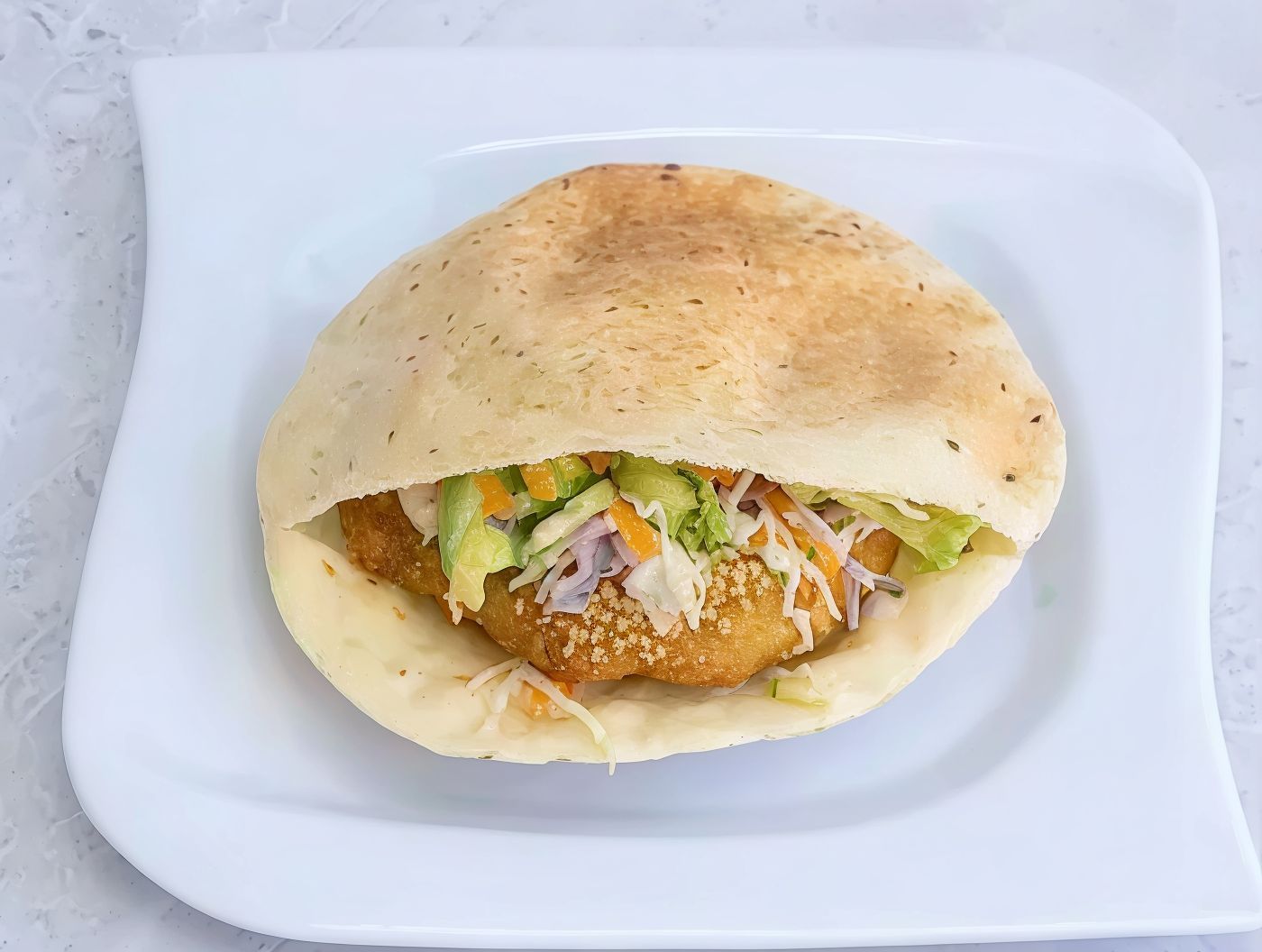 Falafel sandwich with green salad