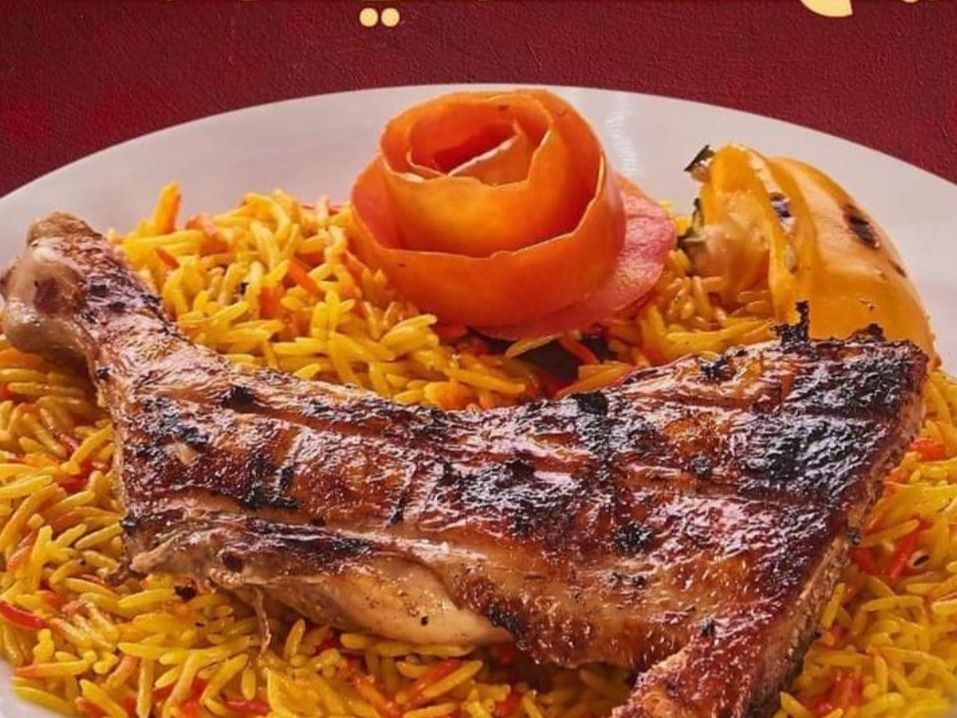 Quarter grilled chicken thigh with rice
