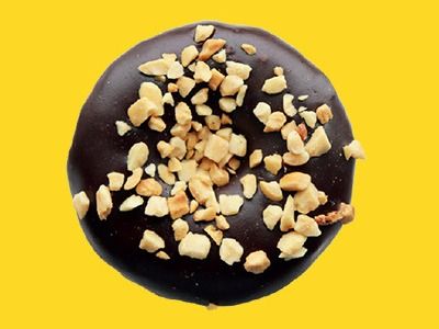 Chocolate Icing Doughnut With Chopped Peanuts