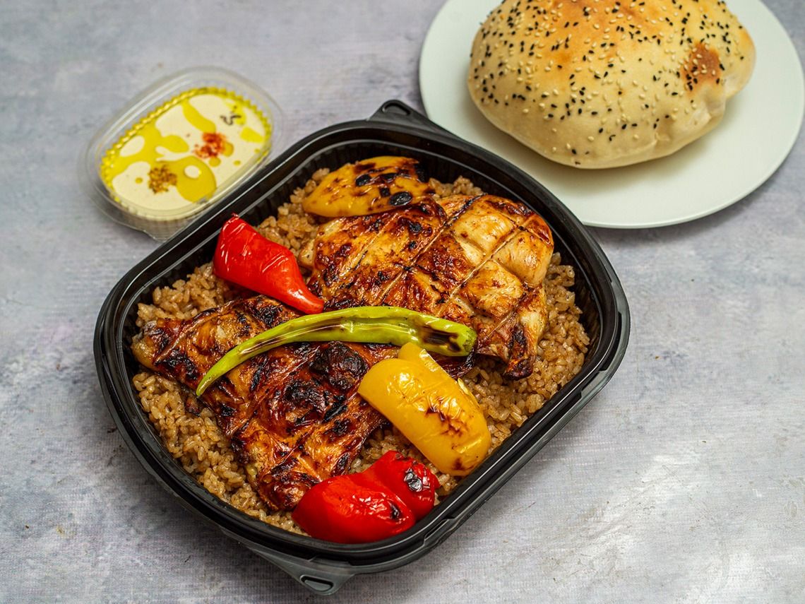 Half Chicken With Bread And Tahini And Pickles