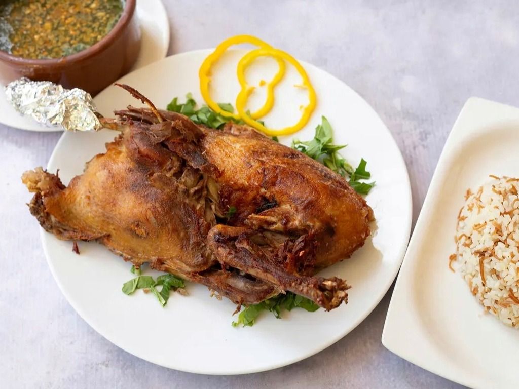 Half duck with rice and molokhia
