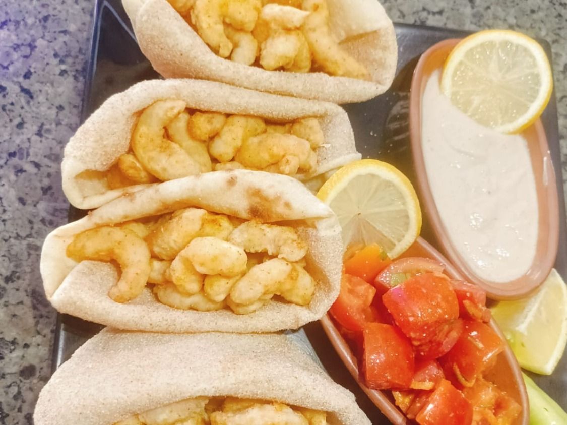 4 Medium Shrimp Sandwiches And Pickles And Tehina