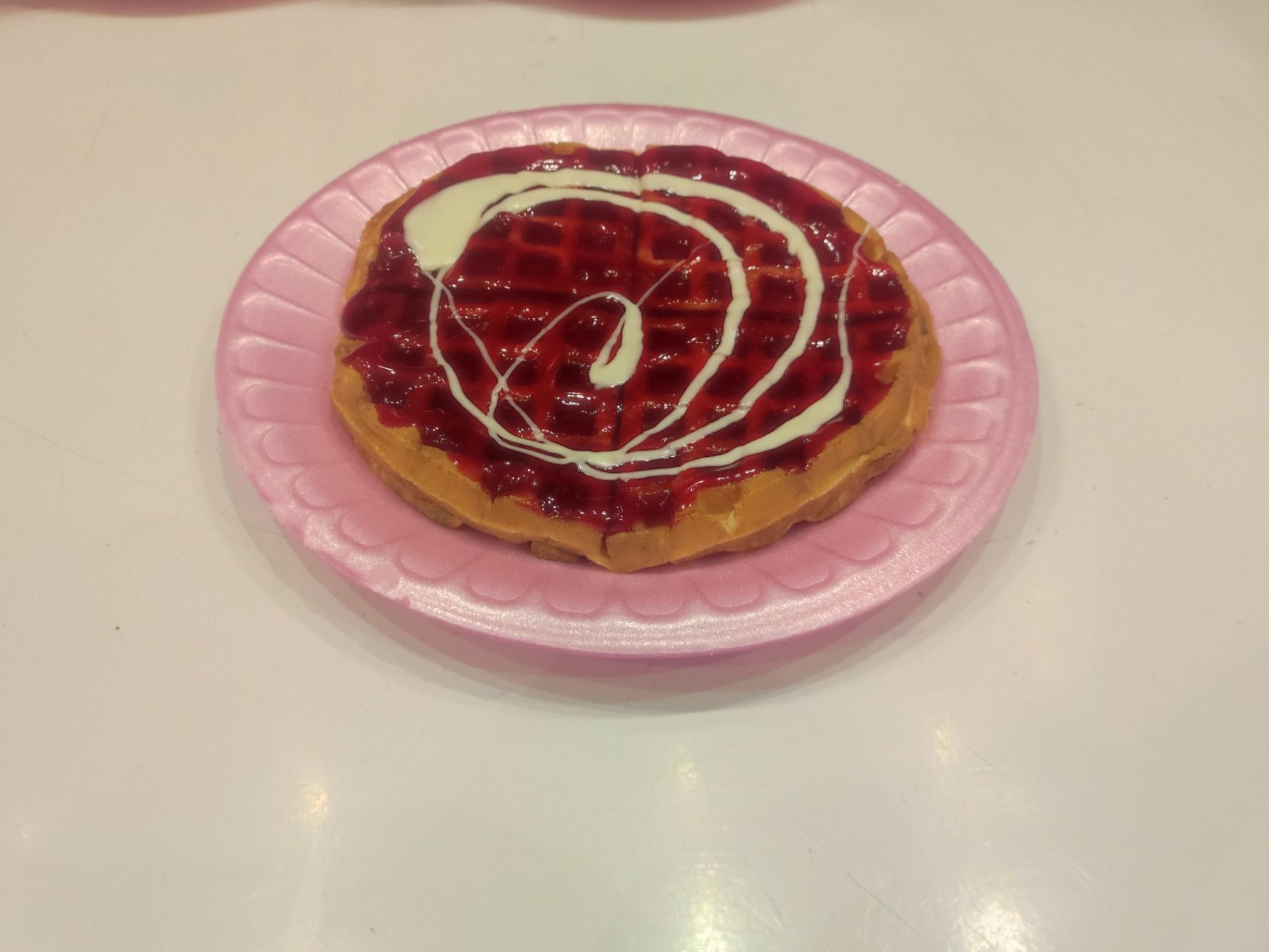 Waffle with strawberry sauce