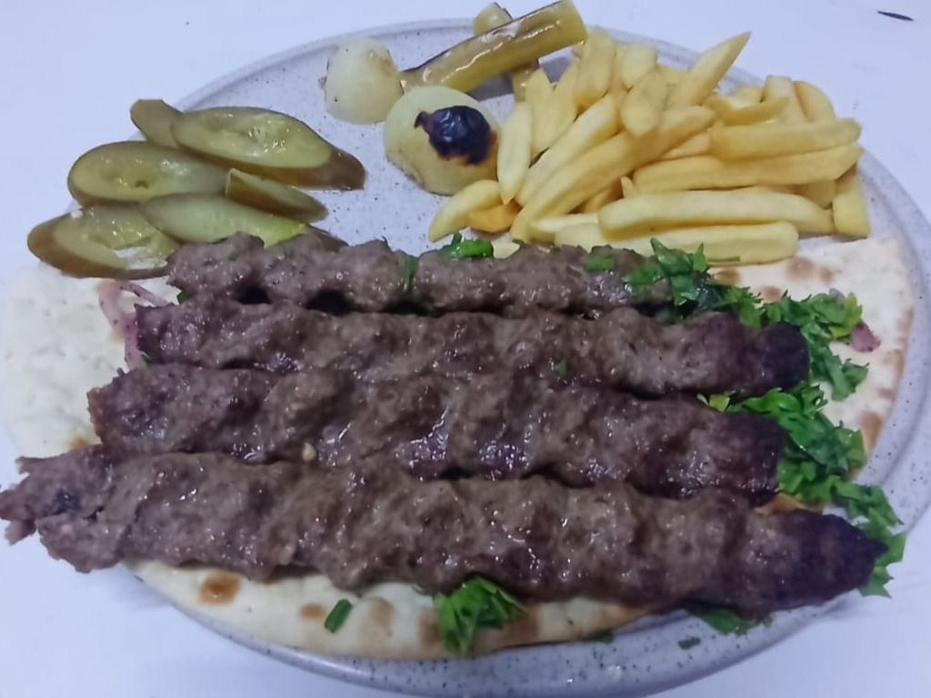 Plain kebab with potatoes and pickled cucumbers