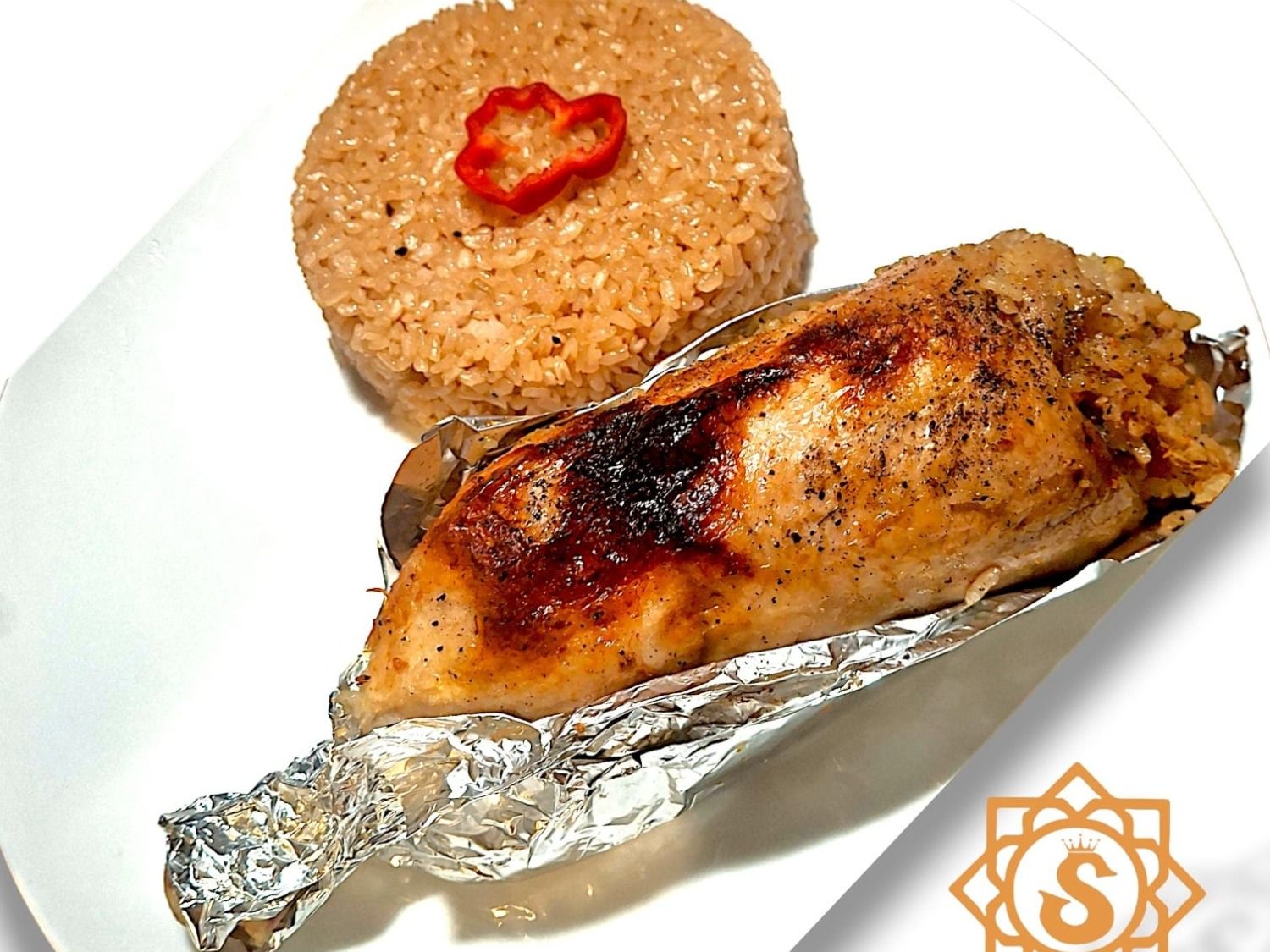 A Quarter of Chicken Stuffed With Seasoned Rice