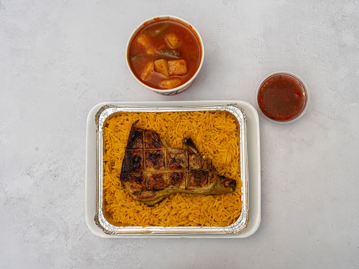 A Quarter Chicken, Rice, Bread, And Mixed Vegetables