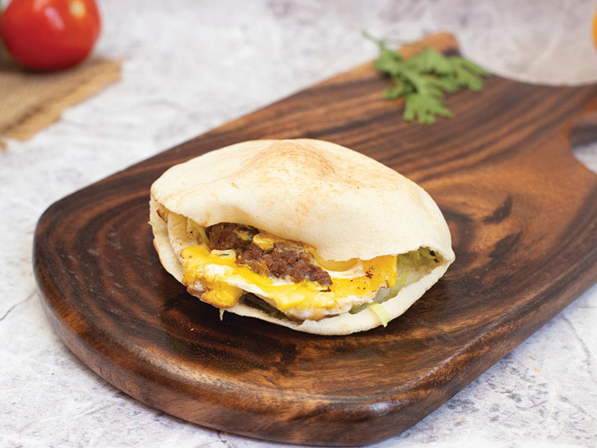 Eggs with sausage sandwich