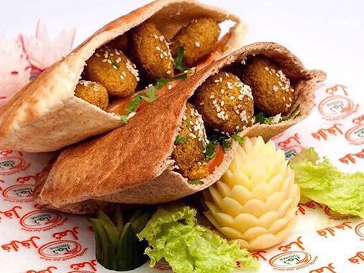 Falafel with eggplant, hummus, and tahini