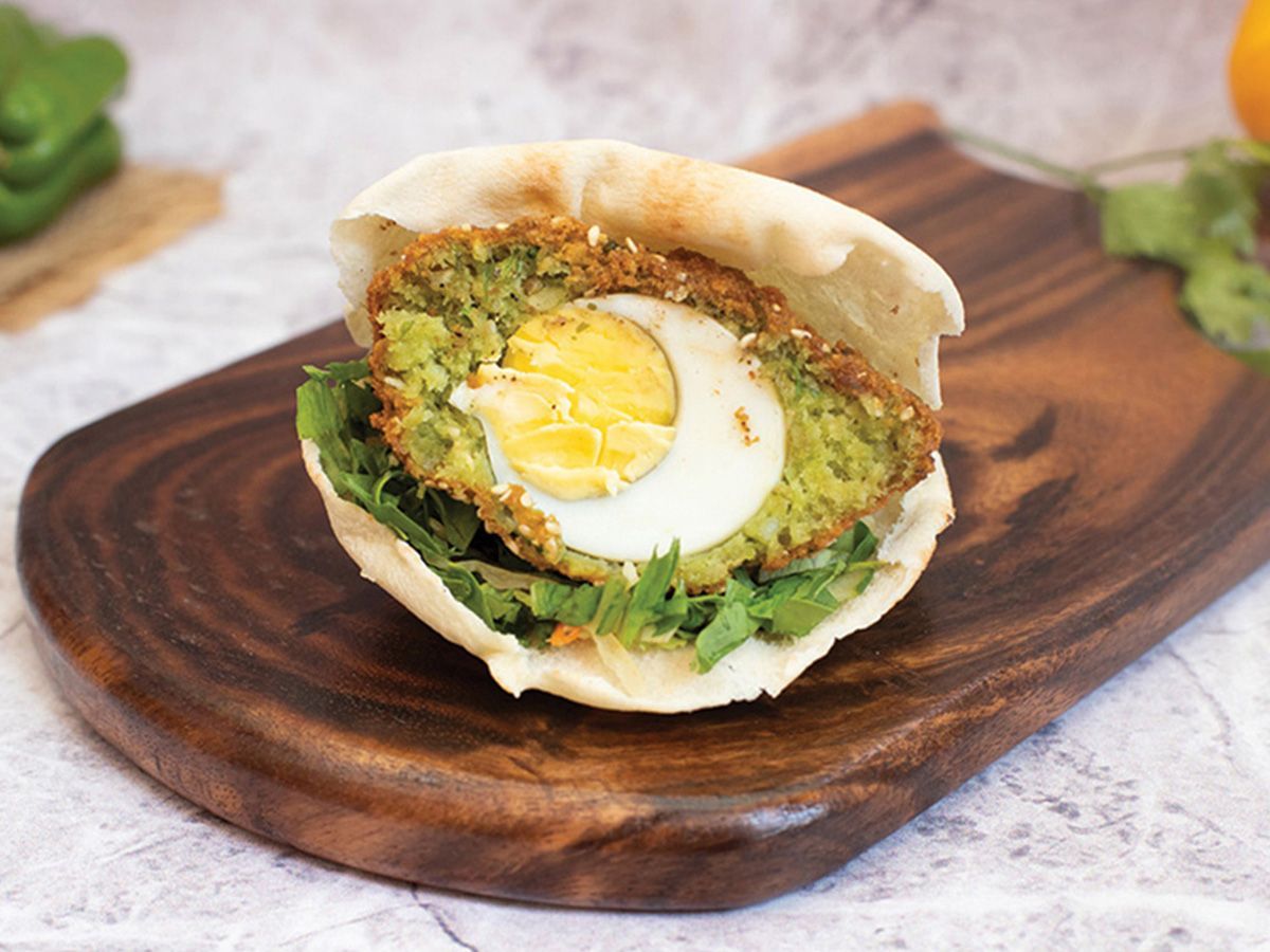 Falafel sandwich stuffed with boiled egg
