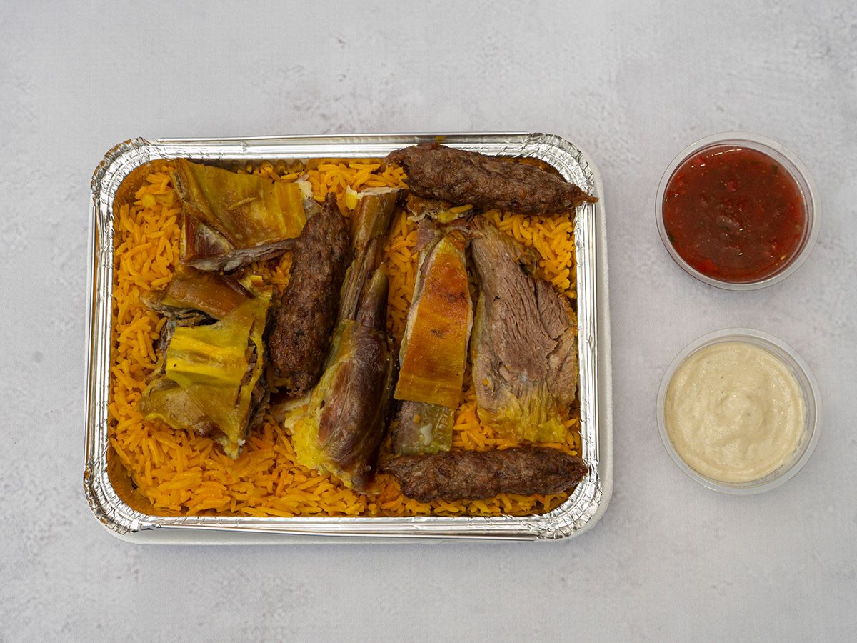 Person Meat 3 Pieces Of Kofta Rice Sauce And Tahini
