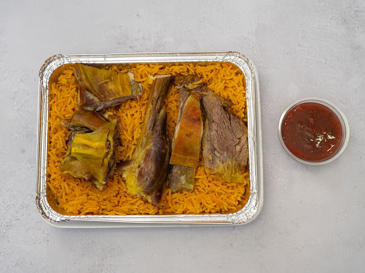 Person Meat Rice And Sauce