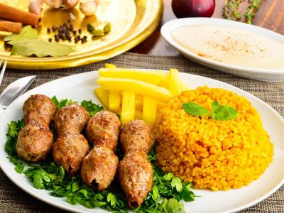 Chicken kofta meal with rice and potatoes